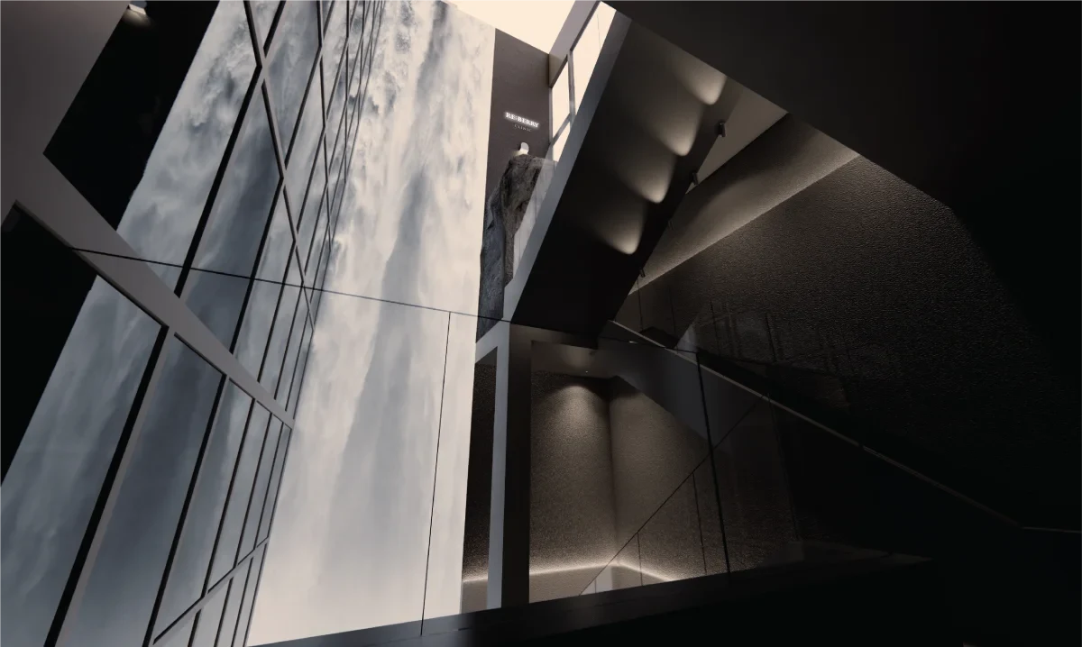 RE:BERRY Gangnam Aesthetic Clinic all-black gallery entrance — stone cave entrance with RB logo and luxury interior design Seoul